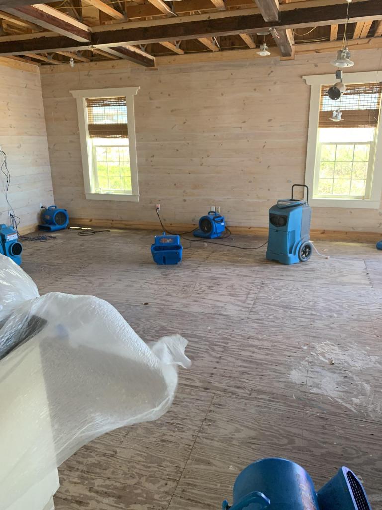 a room that is being remodeled with wood flooring